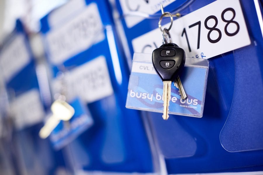 key on keyring with Busy Blue Bus tag